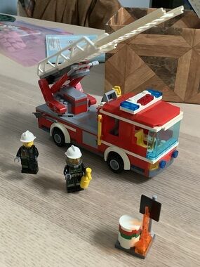 Lego Red and White Fire Truck with Blue Accents and Yellow Accessories